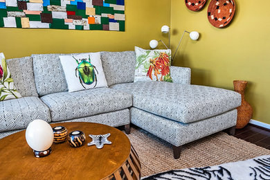 Family room - mid-sized eclectic enclosed dark wood floor and brown floor family room idea in Baltimore with green walls, no fireplace and no tv