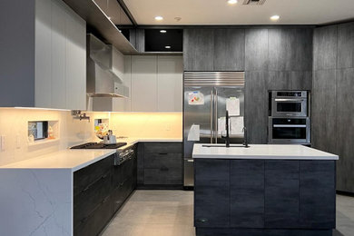 Eat-in kitchen - mid-sized contemporary eat-in kitchen idea in Miami with an island