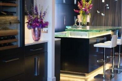 Design ideas for a modern kitchen in Other with glass benchtops and glass sheet splashback.
