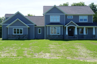 Arts and crafts gray two-story vinyl exterior home photo in New York