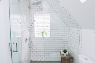 Mid-sized contemporary master bathroom in Toronto with an alcove shower, a one-piece toilet, white tile, subway tile, white walls and porcelain floors.