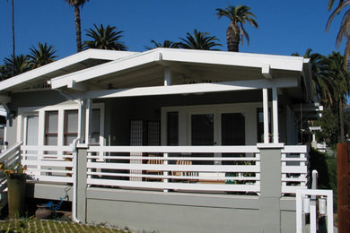 Mid-sized arts and crafts tile back porch idea in Los Angeles with a roof extension