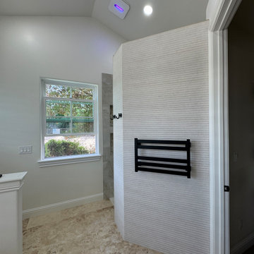 Curd-less walk-in shower; heated floors in bathroom + shower+bench LED