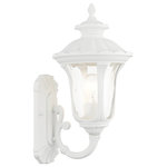 Livex Lighting - Textured White Traditional, Victorian, Sculptural, Outdoor Wall Lantern - From the Oxford outdoor lantern collection, this traditional cast aluminum upward facing single-light small wall lantern design will add curb appeal to any home. It features a handsome, antique-style wall plate and decorative arm. Clear water glass casts an appealing light and lends to its vintage charm. The wall plate, arm and other details are all in a textured white finish. With superb craftsmanship and affordable price, this fixture is sure to tastefully indulge your senses.