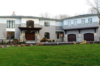 Mid-sized transitional gray two-story mixed siding house exterior idea in DC Metro with a hip roof and a shingle roof