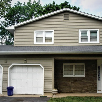 Tuscan Clay Woodgrain Insulated Vinyl and Terra Rosa Ledgestone Siding Installed