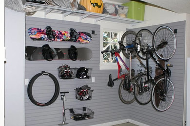 Example of a mid-sized arts and crafts attached garage design in Denver
