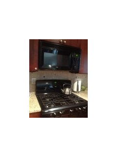 Clearance between gas stove top and microwave above