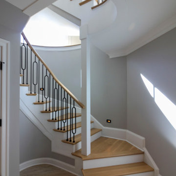 Project #95 | Freestanding Elliptical Staircase with Geometric Iron Balusters