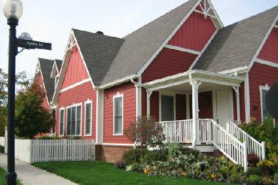 Elegant red two-story vinyl exterior home photo in Indianapolis