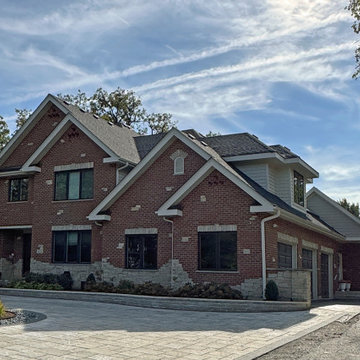Graceful Living, Together: Brick and Stone Exterior, Gabled Roof, Black Windows