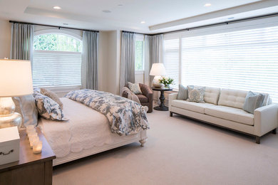 Large transitional master carpeted bedroom photo in Phoenix with white walls, a standard fireplace and a stone fireplace