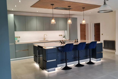 A bespoke handle-less kitchen and island