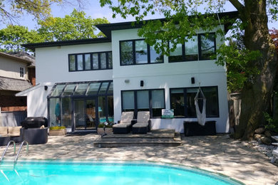 Example of a minimalist exterior home design in Toronto