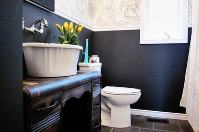 Bathroom - mid-sized transitional 3/4 slate floor and gray floor bathroom idea in Toronto with distressed cabinets, multicolored walls, a vessel sink, furniture-like cabinets and a two-piece toilet