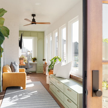 Arched Built-Ins Meet Terracotta Tile in a Light-Filled Sunroom Addition