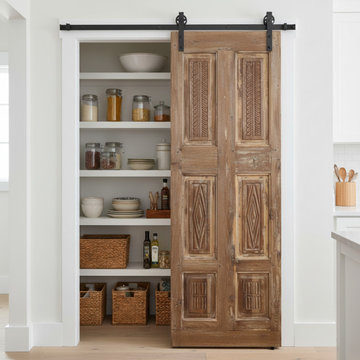Storybook Spanish Revival Features Floral Motifs and Whimsical Carved Doors