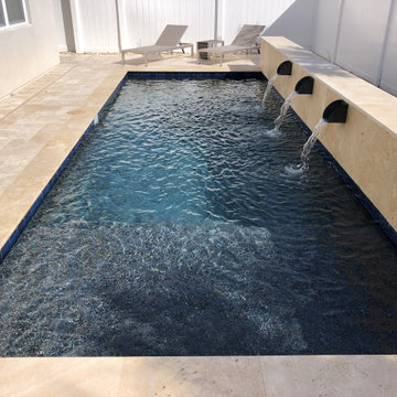 Modern Pool with Water Scuppers in Apopka, Florida