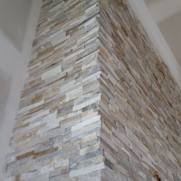 Commanding Natural Stone Fireplace 14 ft Height Wood Mantel