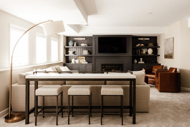 Inspiration for a transitional carpeted and beige floor living room remodel in Minneapolis with beige walls, a standard fireplace and a wall-mounted tv