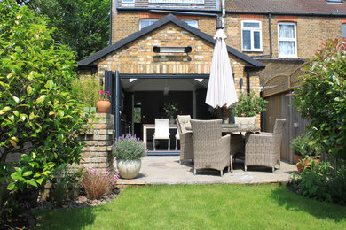 Inspiration for a mid-sized contemporary patio remodel in London
