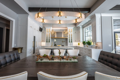 Eat-in kitchen - transitional u-shaped eat-in kitchen idea in Chicago with shaker cabinets, white cabinets, recycled glass countertops, white backsplash, porcelain backsplash, an island and green countertops
