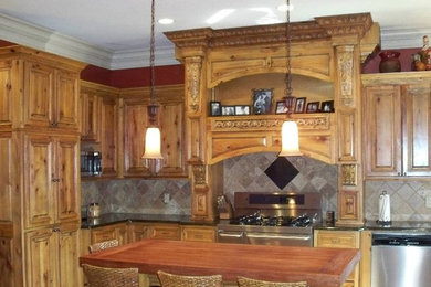 Inspiration for a mid-sized rustic kitchen remodel in Minneapolis with raised-panel cabinets, dark wood cabinets, solid surface countertops, multicolored backsplash, ceramic backsplash and an island