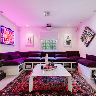 Design ideas for a medium sized eclectic enclosed home cinema in Los Angeles with white walls, a projector screen, grey floors and concrete flooring.