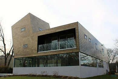 Inspiration for a large modern brown three-story metal exterior home remodel in Chicago