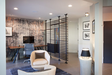 Mid-sized urban freestanding desk vinyl floor and brown floor study room photo in San Francisco with white walls