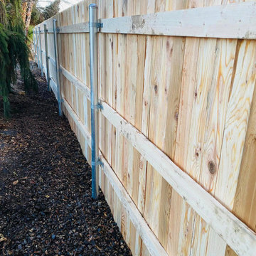 Wood Fence With Metal Rails