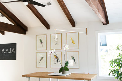 Dining room - eclectic light wood floor dining room idea in San Francisco with white walls