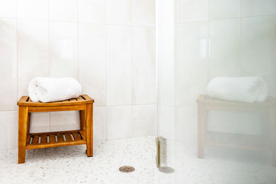 Huge transitional master double-sink, white floor and wall paneling freestanding bathtub photo in Boston with shaker cabinets, light wood cabinets, a freestanding vanity, quartzite countertops, white countertops, a hinged shower door, a two-piece toilet, white walls and an undermount sink