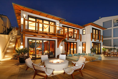 Inspiration for a large coastal backyard patio remodel in Orange County with no cover