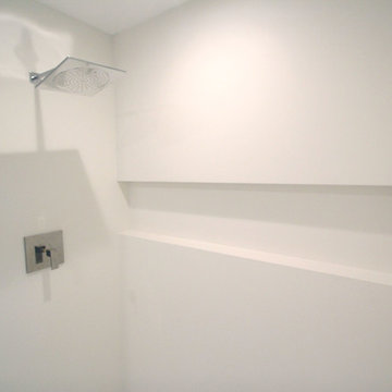 Minimalist White Bathroom - Neolith XL Porcelain tile slab/panel shower w niche