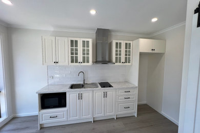 Photo of a contemporary home design in Melbourne.