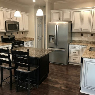 reface cabinets before and after--white w black glaze and black island