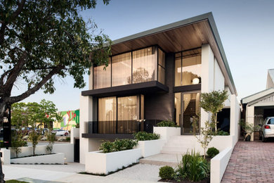 Large contemporary three-storey house exterior in Perth with a black roof.