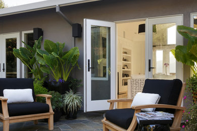 Inspiration for a large contemporary backyard stone patio remodel in San Francisco with no cover