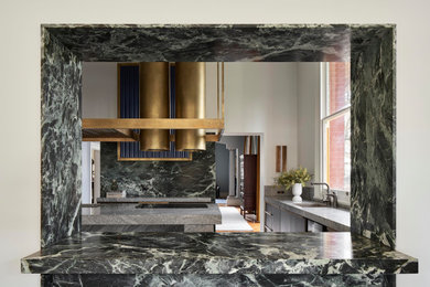 Inspiration for a large eclectic marble floor kitchen remodel in Adelaide with louvered cabinets, marble countertops, green backsplash, marble backsplash, an island and gray countertops