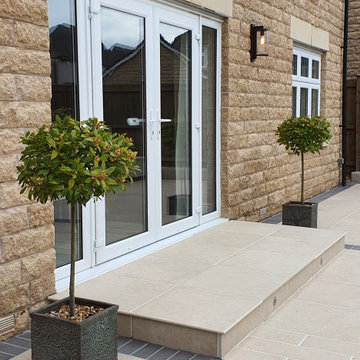 Tytherington, New Build. Porcelain patio with planters and lighting