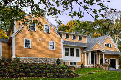 Example of a large transitional three-story mixed siding gable roof design in Boston