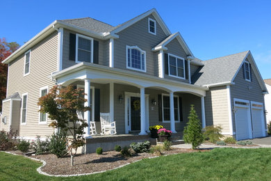Mid-sized traditional gray two-story vinyl house exterior idea in Bridgeport with a hip roof and a shingle roof
