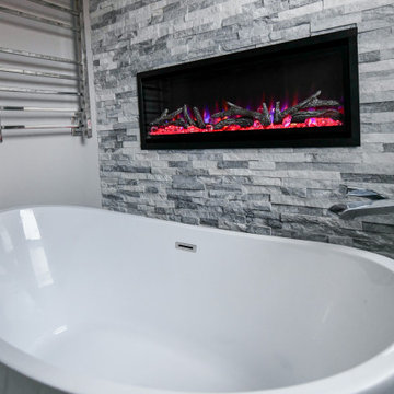 Striking Master Ensuite Featuring a Built-In Electric Fireplace