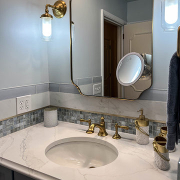 Blue and White Guest Bathroom with Gold Accents