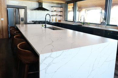 Marbled Quartz with Black Cabinetry Kitchen