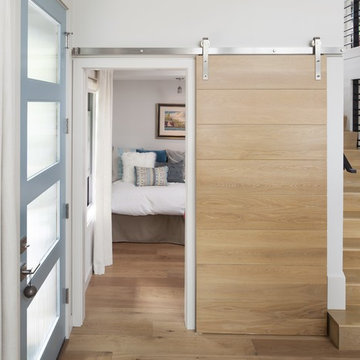 Guestroom with Barn Door covering Entertainment Center