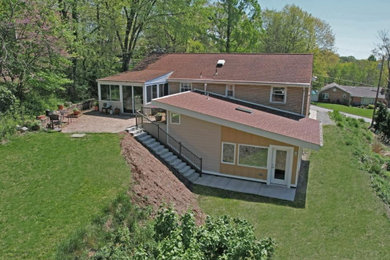Mid-century modern exterior home idea in Other