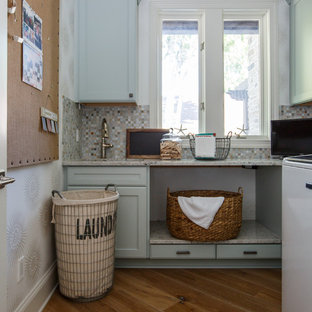 This is an example of a nautical utility room in Jacksonville with a submerged sink, shaker cabinets, turquoise cabinets, granite worktops, white walls, medium hardwood flooring and a side by side washer and dryer.