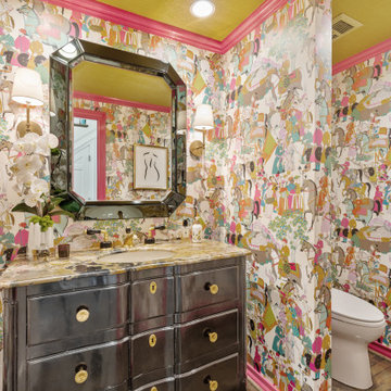 Vibrant and Eclectic Powder Room with Bold Wallpaper and Luxurious Vanity